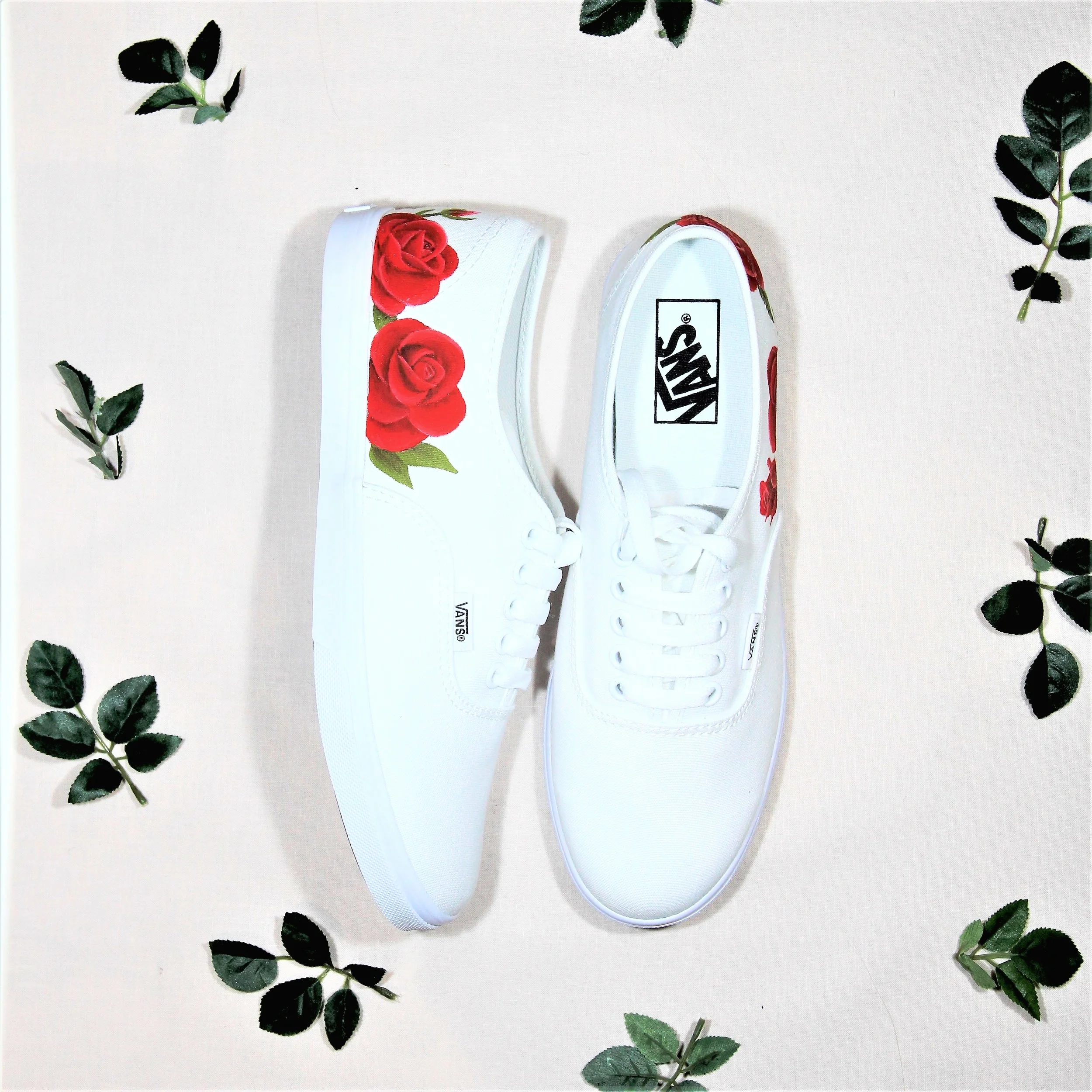 Trainers with cheap roses on them